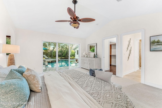 carpeted bedroom featuring lofted ceiling, access to outside, a walk in closet, ceiling fan, and a closet