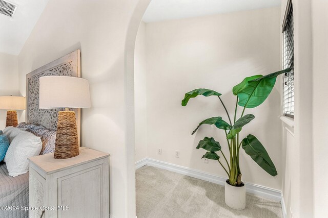 401 S Palm Ave, Indialantic, FL 32903 - hallway with arched walkways and carpet