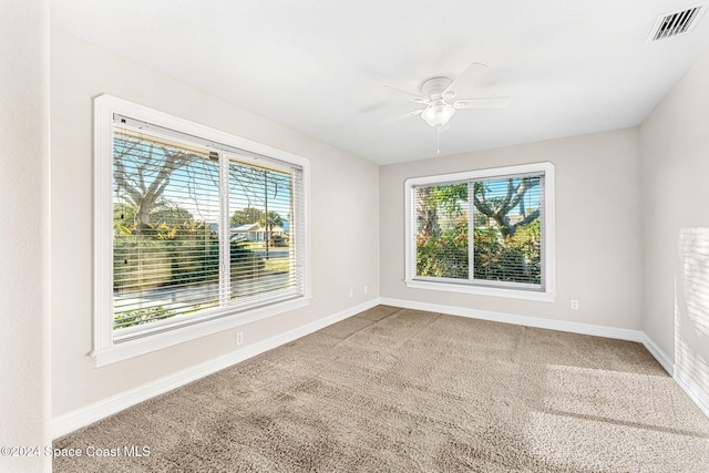 empty room with carpet floors and ceiling fan