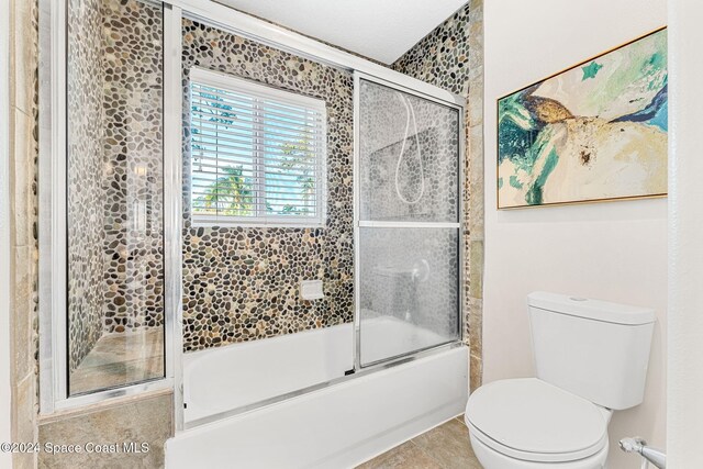 401 S Palm Ave, Indialantic, FL 32903 - bathroom with toilet and enclosed tub / shower combo