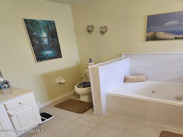 bathroom with tile patterned flooring, a bathtub, and toilet