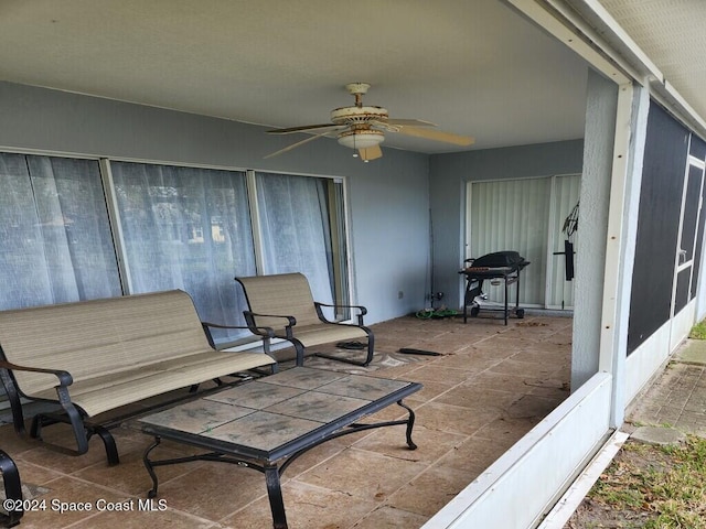 view of patio featuring ceiling fan