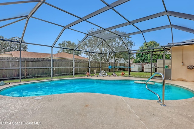 view of pool featuring a patio area and a lanai