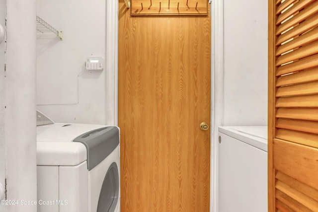 washroom featuring separate washer and dryer