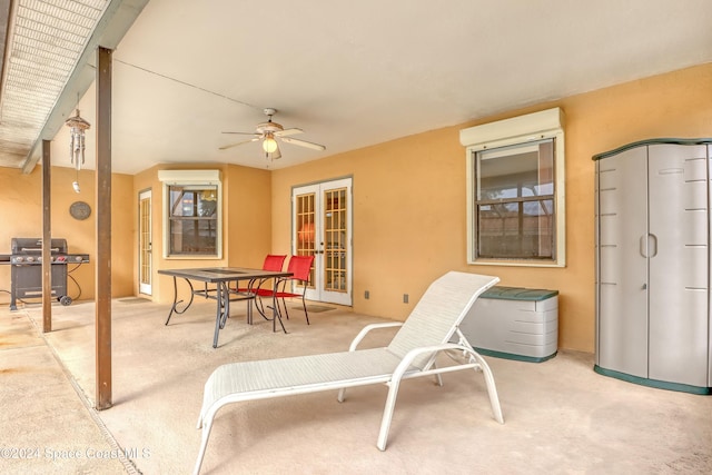 view of patio / terrace featuring a wall mounted air conditioner, grilling area, and ceiling fan