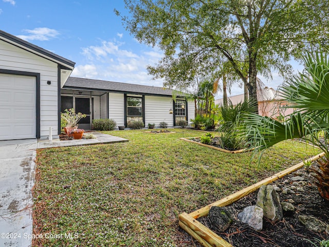 view of yard featuring a garage