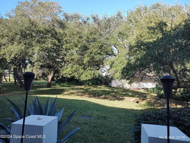 272 Aquarina Blvd Unit 272, Melbourne Beach, FL 32951 - view of grassy yard