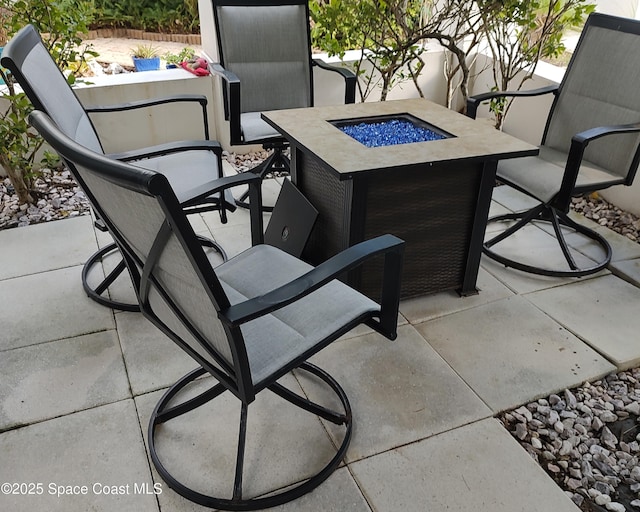 view of patio / terrace with a fire pit