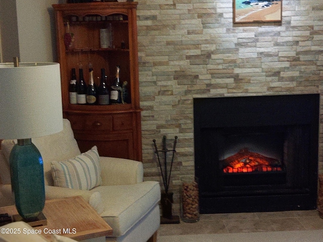 272 Aquarina Blvd Unit 272, Melbourne Beach, FL 32951 - living room featuring a lit fireplace