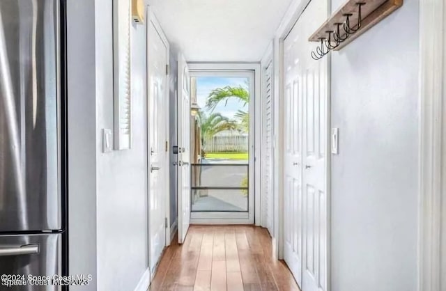 doorway to outside with hardwood / wood-style floors