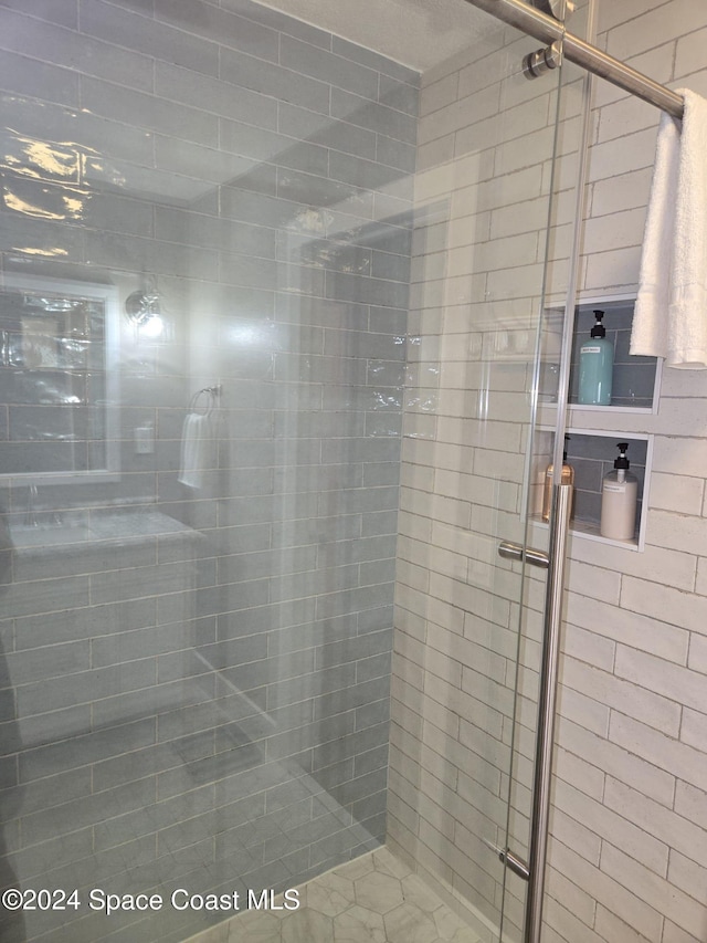 bathroom featuring an enclosed shower