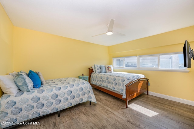 bedroom with ceiling fan and hardwood / wood-style floors