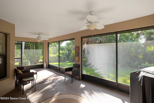 unfurnished sunroom with ceiling fan and a healthy amount of sunlight