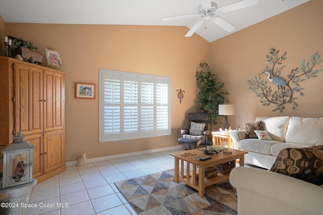 tiled living room featuring ceiling fan and vaulted ceiling