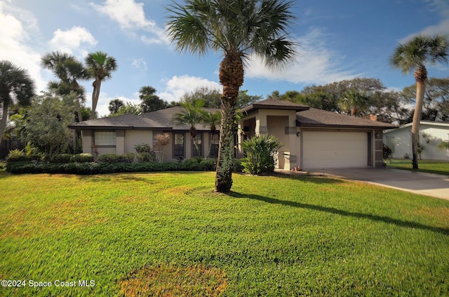 view of front of house featuring a garage and a front yard