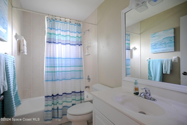 full bathroom with vanity, toilet, and shower / bath combo with shower curtain