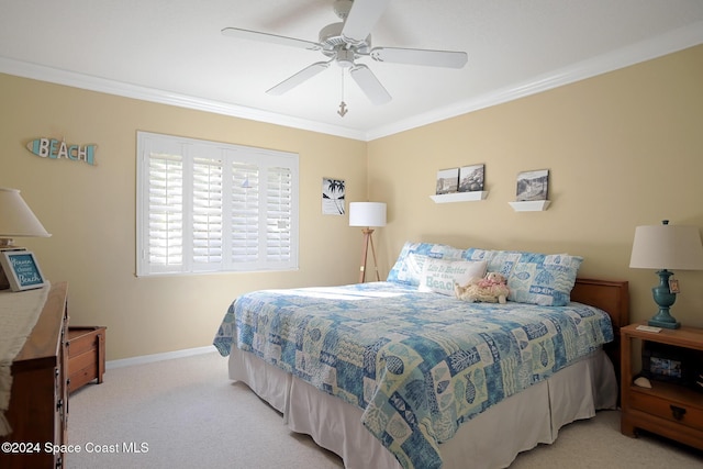 bedroom with ceiling fan, ornamental molding, and light carpet