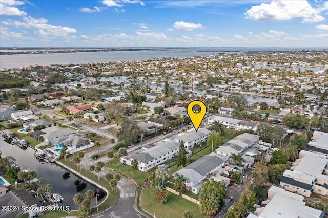 birds eye view of property featuring a water view