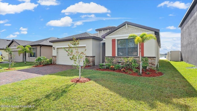 view of front of home with a garage and a front yard