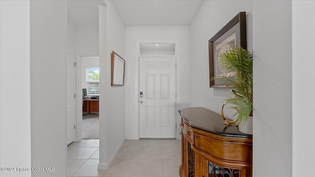 hallway with light tile patterned floors