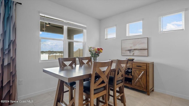 dining room featuring light tile patterned floors and a wealth of natural light