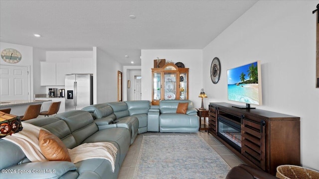 tiled living room with a textured ceiling