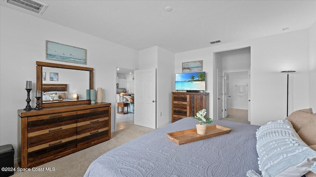 bedroom featuring light colored carpet