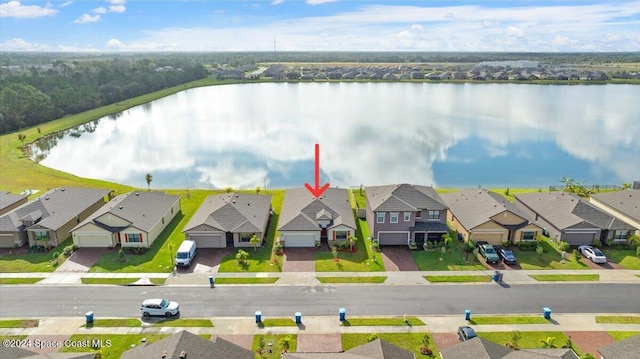 birds eye view of property featuring a water view