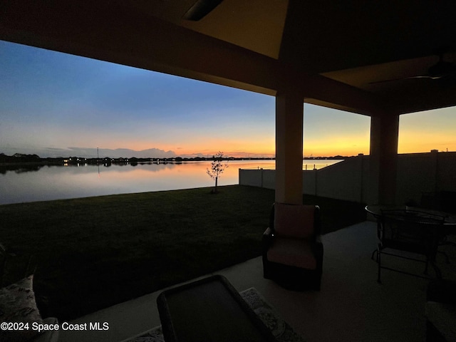 patio terrace at dusk with a water view