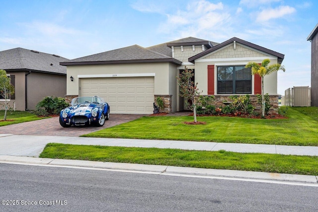 view of front of house with a garage and a front yard