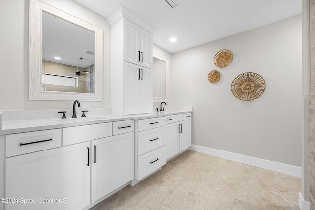 bathroom with vanity and walk in shower