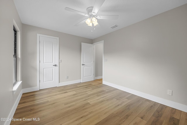 unfurnished bedroom featuring ceiling fan and light hardwood / wood-style flooring