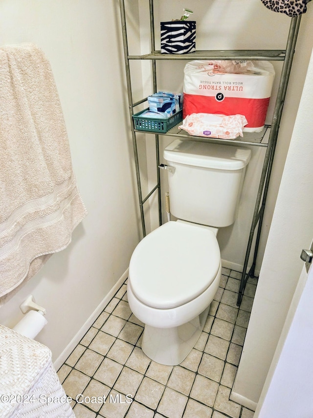 bathroom featuring tile patterned floors and toilet