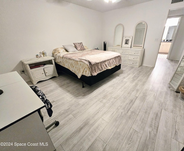 bedroom featuring light hardwood / wood-style floors