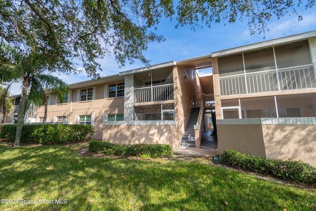 997 Sonesta Ave NE Unit 206, Palm Bay, FL 32905 - view of property featuring stairs