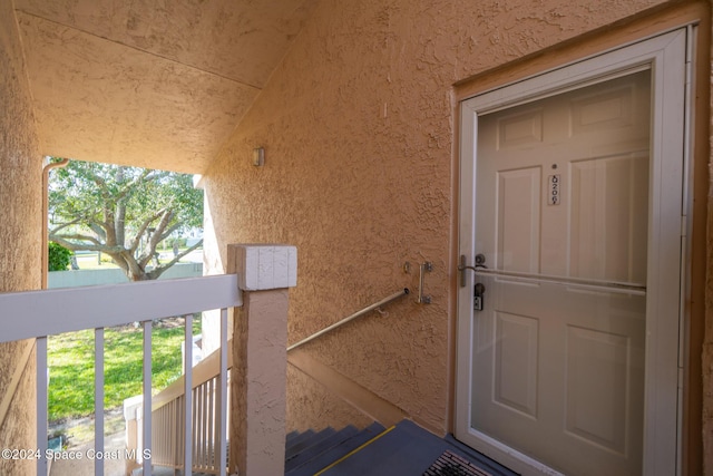 997 Sonesta Ave NE Unit 206, Palm Bay, FL 32905 - property entrance featuring stucco siding and a balcony