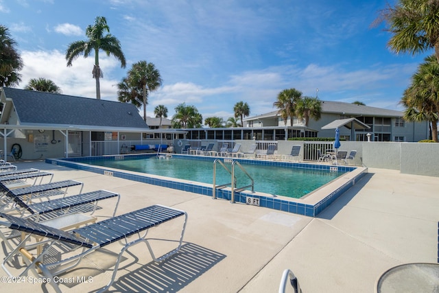 997 Sonesta Ave NE Unit 206, Palm Bay, FL 32905 - community pool with a patio area