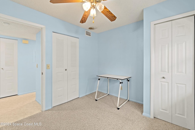 997 Sonesta Ave NE Unit 206, Palm Bay, FL 32905 - unfurnished bedroom with carpet flooring and ceiling fan
