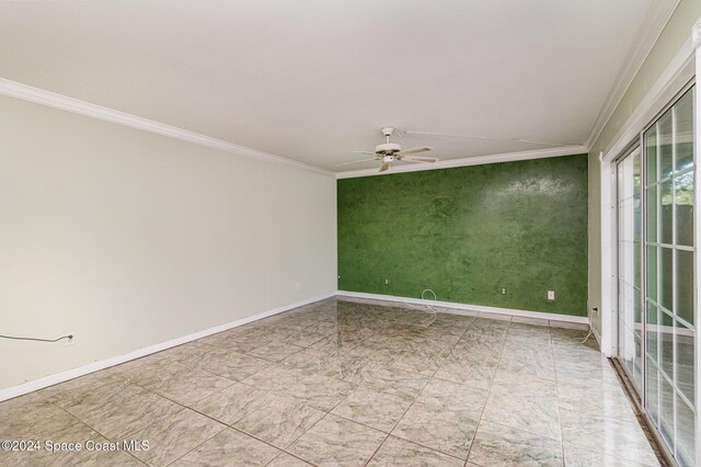 unfurnished room with ceiling fan and ornamental molding