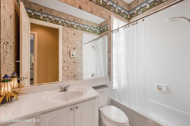 full bathroom featuring vanity, toilet, and shower / bathtub combination with curtain