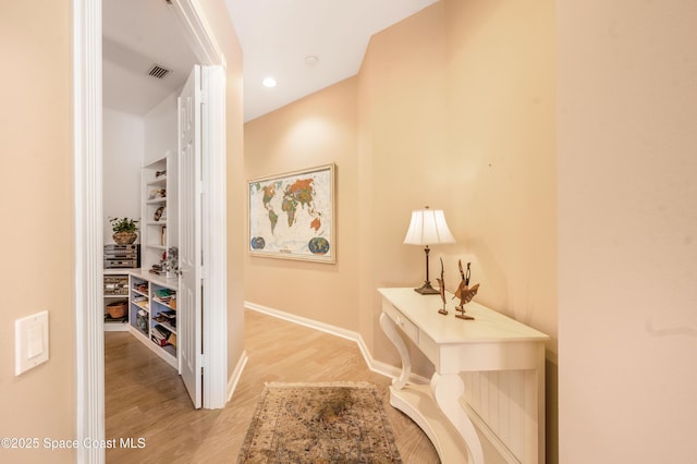 hall with light hardwood / wood-style floors