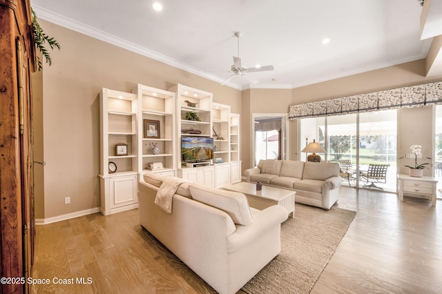 living room featuring light wood-type flooring, ceiling fan, and crown molding