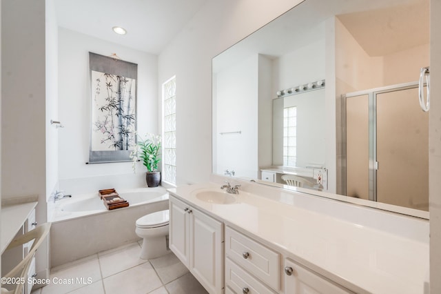 full bathroom featuring tile patterned flooring, vanity, separate shower and tub, and toilet