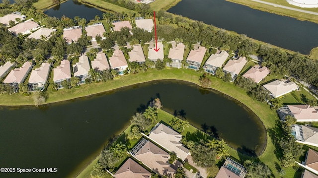 birds eye view of property featuring a water view