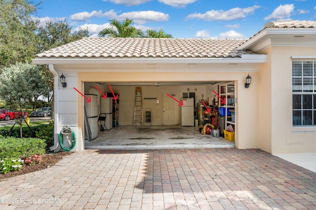 garage featuring white fridge