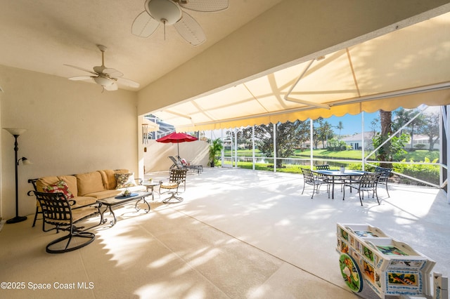 view of patio featuring an outdoor living space and ceiling fan