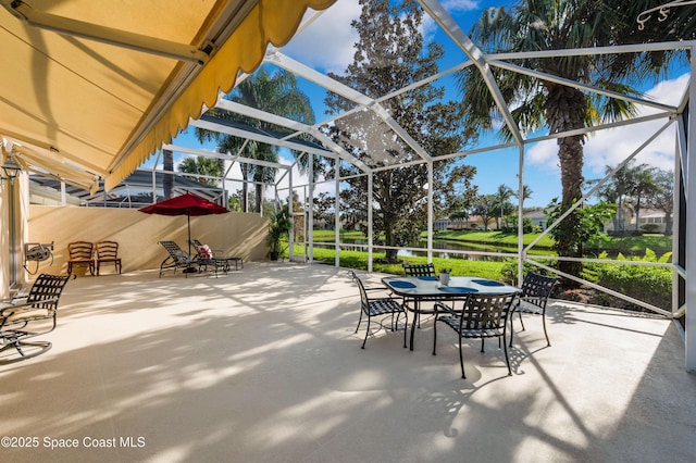 view of patio with glass enclosure