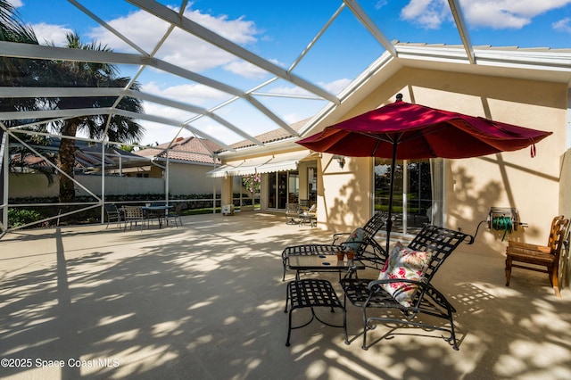 view of patio / terrace featuring a lanai