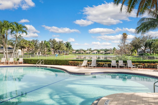 view of swimming pool with a patio