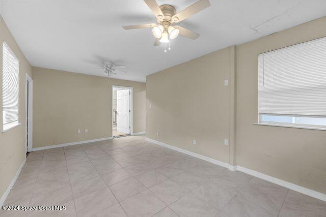 unfurnished room featuring ceiling fan